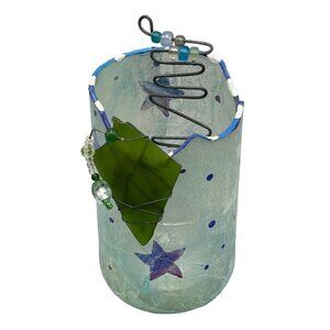 homemade candle holder decoupaged outside blue with stars added green glass READ